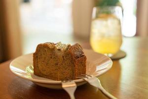 Banana cake on plate in cafe restaurant - soft selective focus point photo