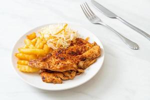 Grilled spicy barbecue chicken steak with french fries photo