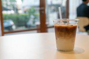 Iced latte coffee cup in cafe restaurant photo