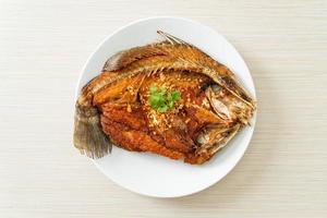 Fried Sea Bass Fish with Garlic photo