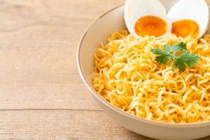 Instant noodles bowl with salt egg photo