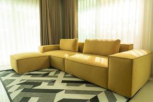 Empty golden mustard sofa in living room photo