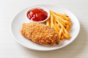 Fried chicken breast fillet steak with French fries and ketchup photo