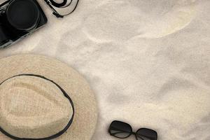Accessories costume for the trip on a sand on the beach background