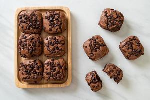 Dark chocolate brownies with chocolate chips on top photo