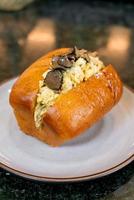 Bun or bread with scrambled eggs and truffle mushroom photo