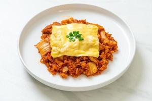 Kimchi fried rice with pork and topped cheese - Asian and fusion food style photo