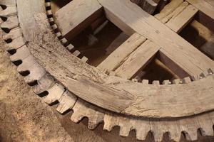 Ancient wooden gearwheel photo