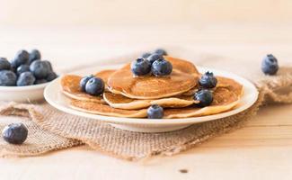 Stack of pancakes with fresh blueberry photo