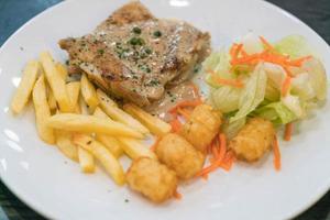 Chicken steak with peppers sauce photo