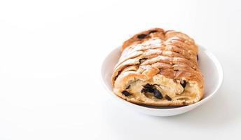 Raisin bread on white plate photo