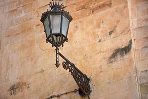 Italy, Lecce, city with Baroque architecture and churches and archaeological remains. Detail of baroque lamppost photo