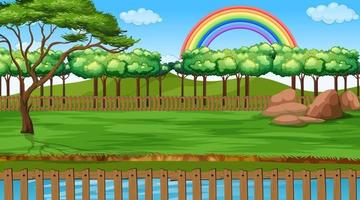 Escena del paisaje del parque con arco iris en el cielo vector