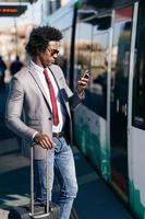 Black Businessman waiting for the next train photo