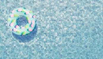Inflatable ring floating in swimming pool