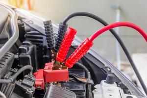 Charging car with electricity trough cables, Selective focus photo