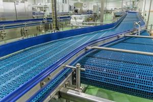 Empty conveyor belt of production line, part of industrial equipment photo
