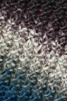 Colorful handmade winter scarf with alpacas wool close up photo