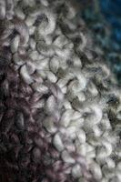 Colorful handmade winter scarf with alpacas wool close up photo