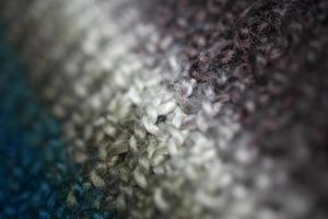 Colorful handmade winter scarf with alpacas wool close up photo