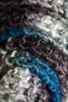 Colorful handmade winter scarf with alpacas wool close up photo