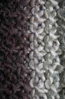 Colorful handmade winter scarf with alpacas wool close up photo