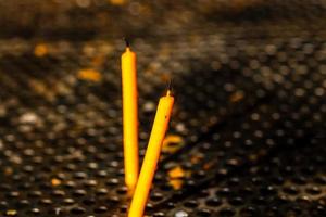 Burning melting candles in memory of the dead, close up. photo