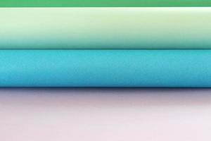 Roles of color paper background photo