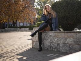 young teen girl with well-groomed hair with beautiful long legs photo