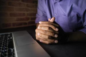 hacker hand stealing data from laptop top down photo