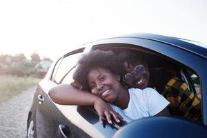 happy african american woman in a car, lifestyle photo