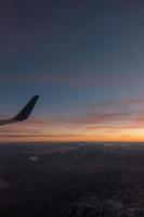 sunset over colorado rockies from an airplane
