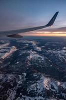 sunset over colorado rockies from an airplane photo