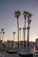 early morning with sunrise at hotel and palm trees photo