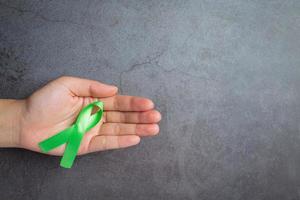 Green ribbon. Glaucoma awareness month photo