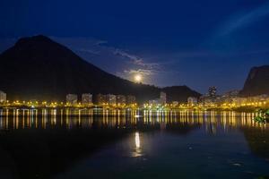 Full moon over Lagoon Rodrigo de Freitas in Rio de Janeiro, Brazil photo