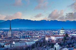 Turin panoramic skyline at sunset with Alps in background photo