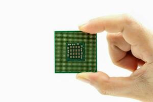 Realistic cpu back view processor chip in hand on white background photo