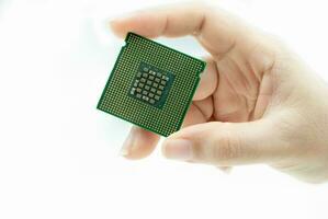 Realistic cpu back view processor chip in hand on white background photo
