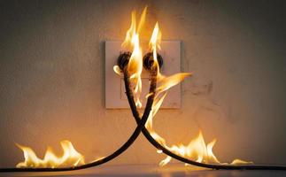 On fire electric wire plug Receptacle photo