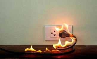 On fire electric wire plug Receptacle wall partition photo