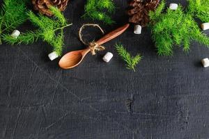 Wooden spoon and pine tree background Christmas background concept photo