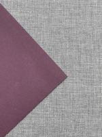 A purple textured fabric on natural linen, background image photo