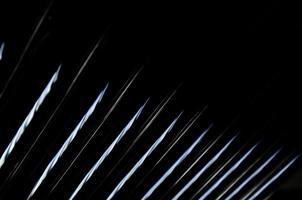 abstract dark black background with shiny metallic lines photo