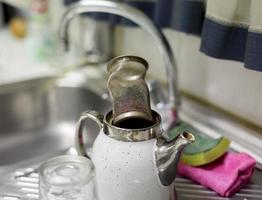 Teapot on a sink photo