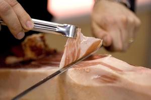 Serrano ham cut in Spain photo