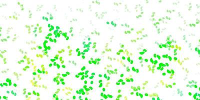 Light green, yellow vector backdrop with chaotic shapes.