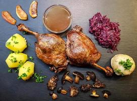 Baked Duck with red cabbage and forest mushrooms photo