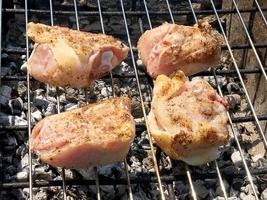 grilled chicken meat on the grill ready for eating barbeque photo