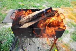 dark grey black coals inside metal brazier photo